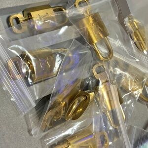 Authentic Louis Vuitton lock and key# 312 Needs Polishing But Good Condition